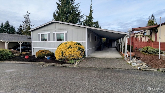 view of side of property featuring a carport