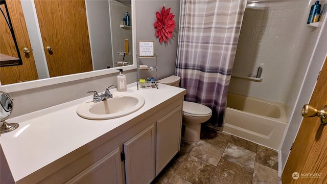 full bathroom featuring toilet, shower / bathtub combination with curtain, stone finish floor, and vanity