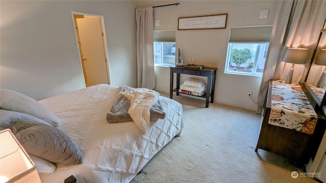 bedroom featuring light colored carpet