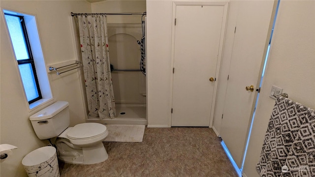 full bathroom with a closet, a shower stall, and toilet