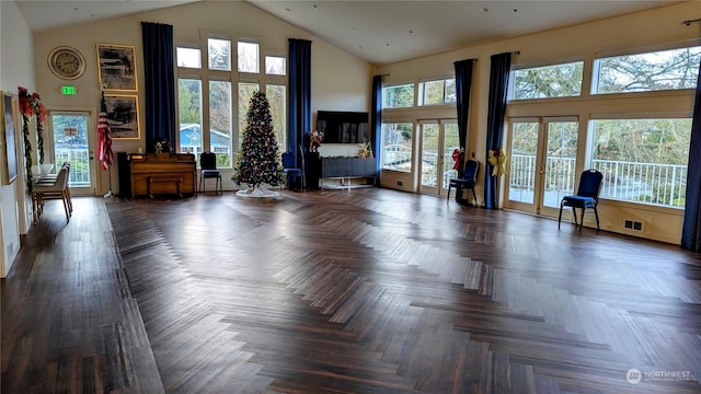 interior space with a healthy amount of sunlight and dark parquet flooring