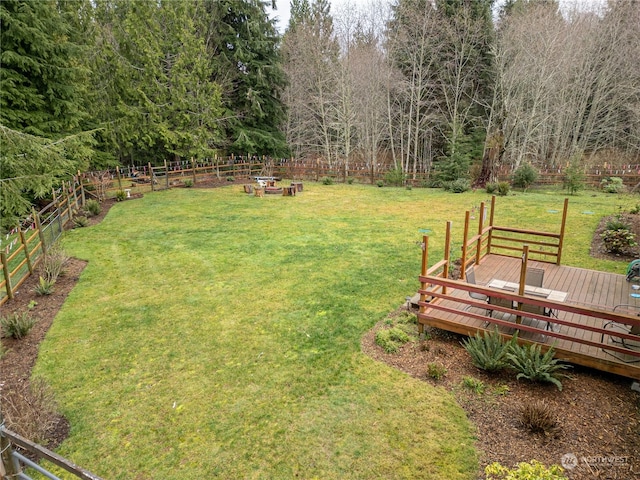 view of yard with a wooden deck