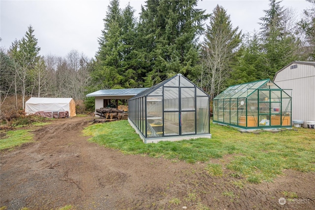 view of outdoor structure featuring a yard