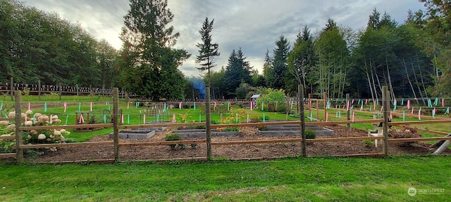 view of gate featuring a lawn