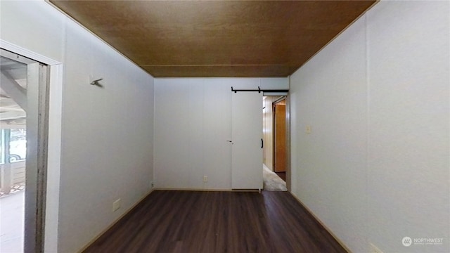 spare room with hardwood / wood-style floors