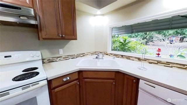 kitchen with sink and white appliances