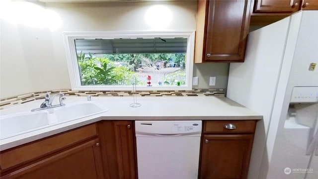 kitchen with sink and white appliances