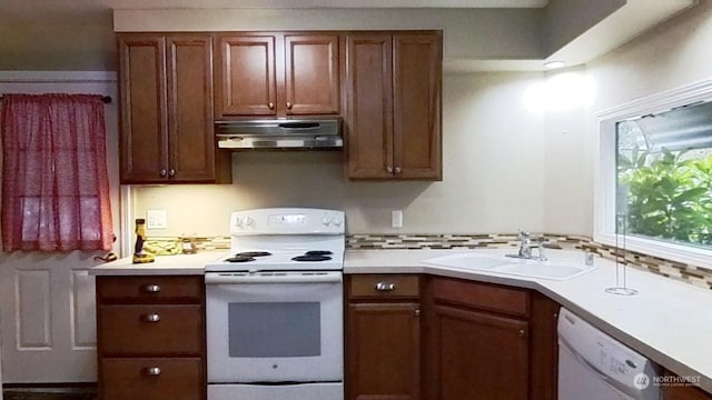 kitchen with sink and white appliances