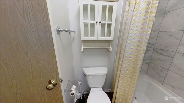 bathroom with toilet and a tub to relax in