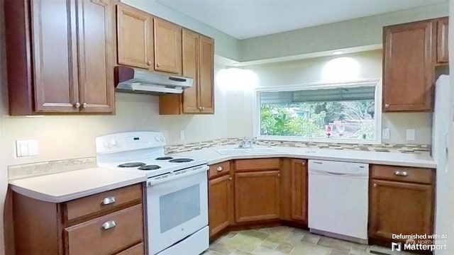 kitchen with sink, tasteful backsplash, and white appliances