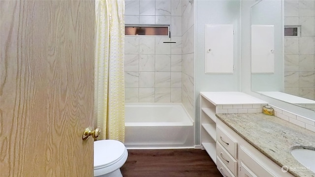 full bathroom featuring toilet, shower / tub combo, hardwood / wood-style flooring, and vanity