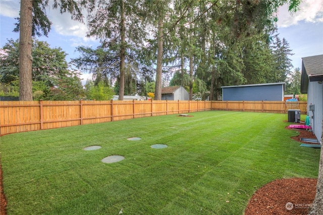 view of yard featuring central AC unit