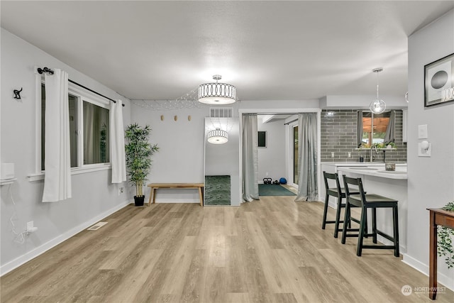 dining area featuring light hardwood / wood-style flooring and sink