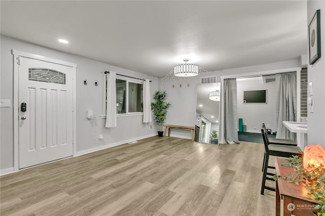 foyer entrance featuring light wood-type flooring