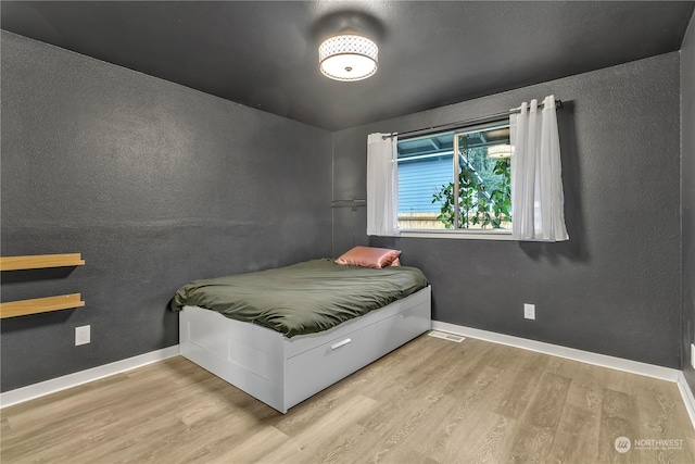 bedroom featuring light hardwood / wood-style flooring