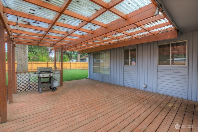 wooden terrace featuring a pergola, grilling area, and a yard