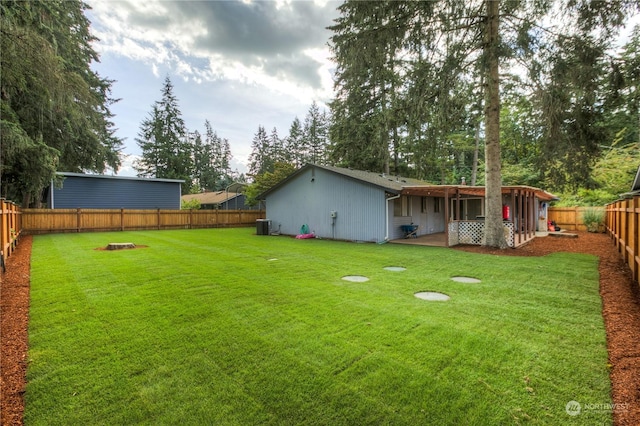 view of yard featuring central AC