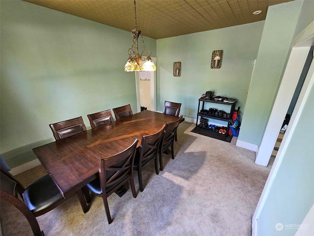 dining room with baseboards and carpet