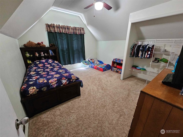 carpeted bedroom with lofted ceiling and a ceiling fan