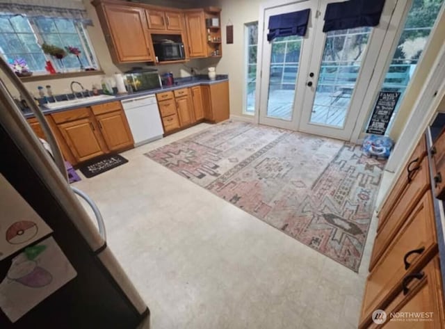 kitchen with open shelves, white dishwasher, a sink, french doors, and black microwave