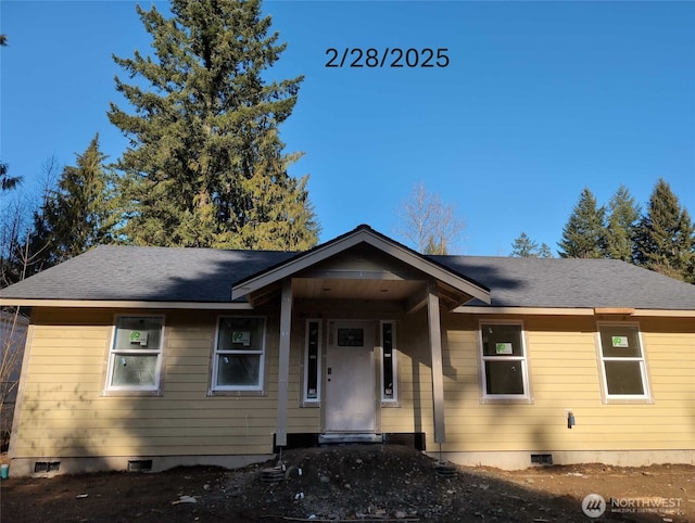 single story home featuring a shingled roof and crawl space