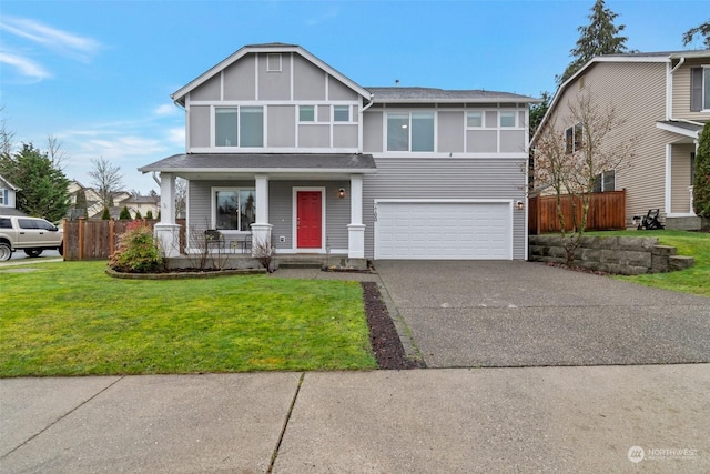 view of front of house featuring a garage and a front lawn