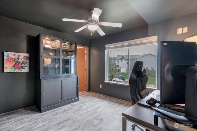 office area with ceiling fan and light hardwood / wood-style flooring