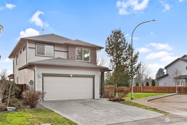 view of front of house with a front lawn and a garage