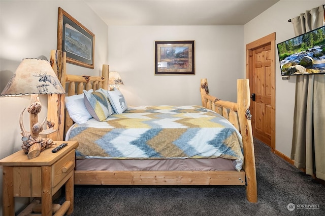 bedroom featuring dark colored carpet