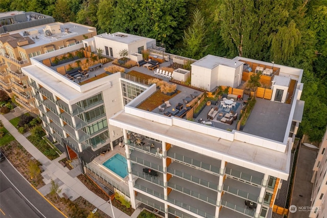 1250 Alki Ave SW Unit 3B, Seattle, WA 98116 - aerial view of property and surrounding area with a pool area and a forest
