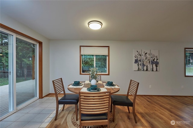 dining area featuring light tile patterned flooring