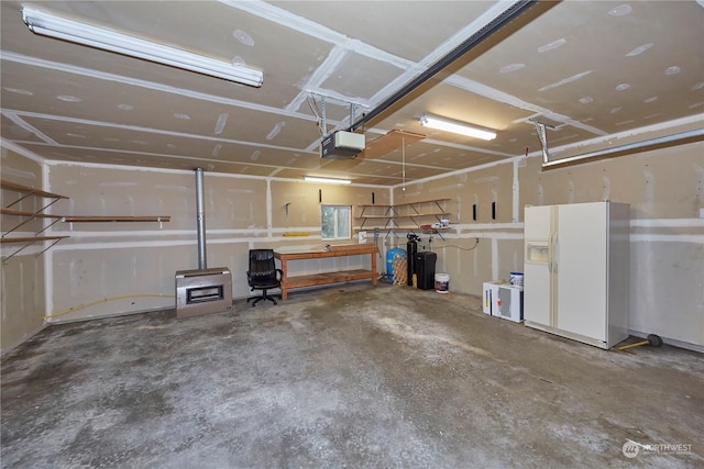 garage with white fridge with ice dispenser and a garage door opener