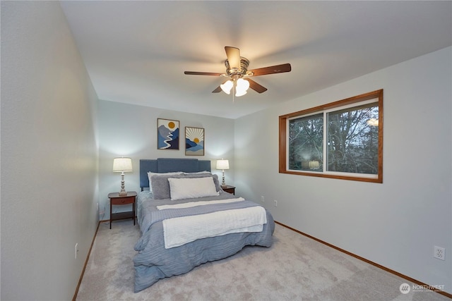 bedroom featuring ceiling fan and light carpet