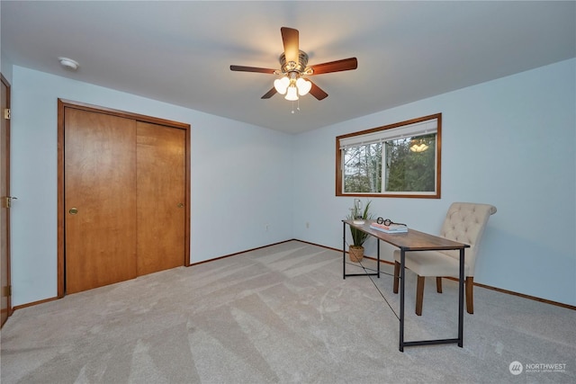 office space featuring light colored carpet and ceiling fan