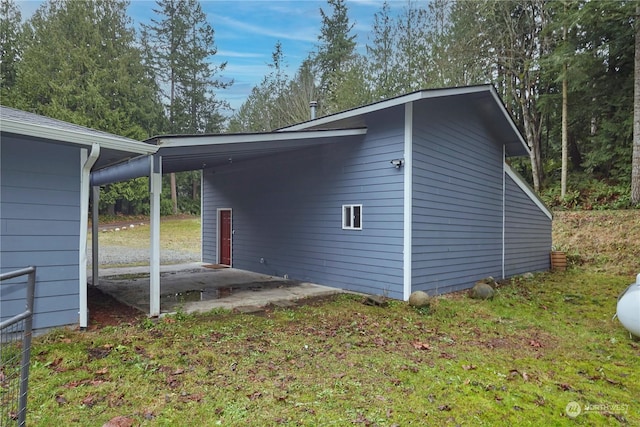 view of home's exterior with a carport