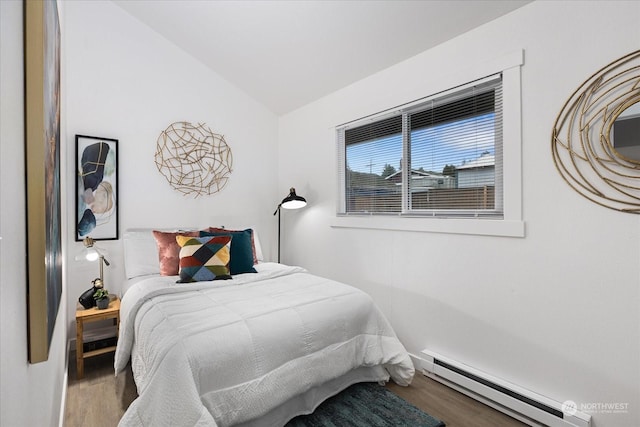 bedroom with baseboard heating, wood-type flooring, and lofted ceiling