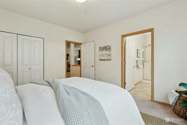 carpeted bedroom with ensuite bath and a closet