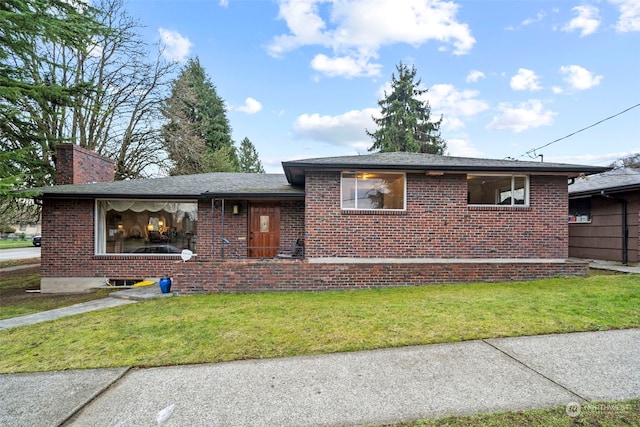 view of front of home with a front yard