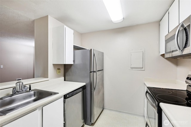 kitchen featuring white cabinetry, sink, and stainless steel appliances