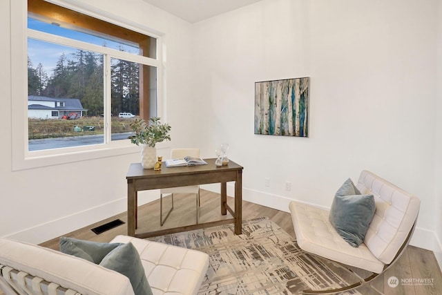 office area with hardwood / wood-style floors