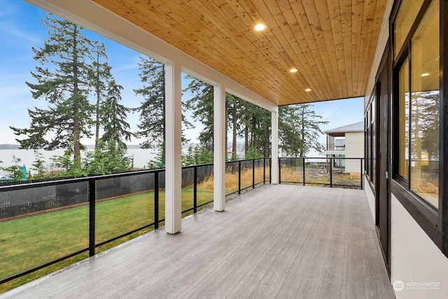 unfurnished sunroom featuring wooden ceiling