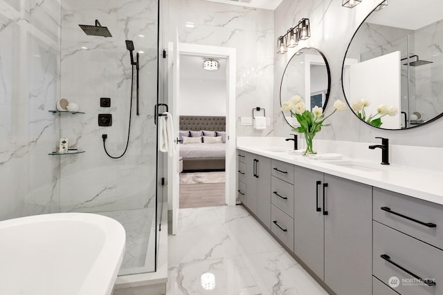 bathroom featuring vanity and separate shower and tub