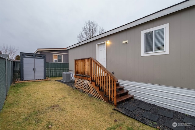 exterior space with a shed and central AC unit