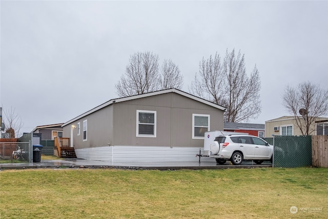 view of side of property with a yard