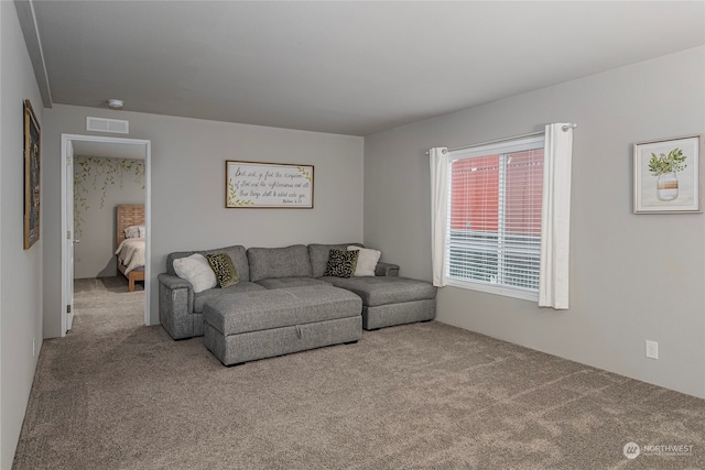 living room featuring light carpet