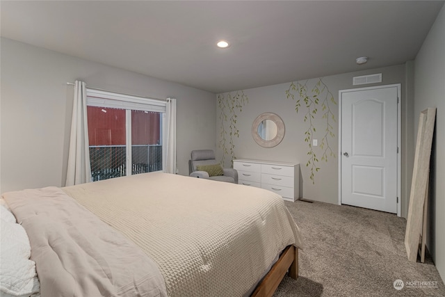 carpeted bedroom with access to exterior