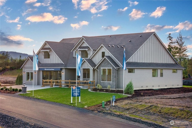 craftsman-style home with a front lawn