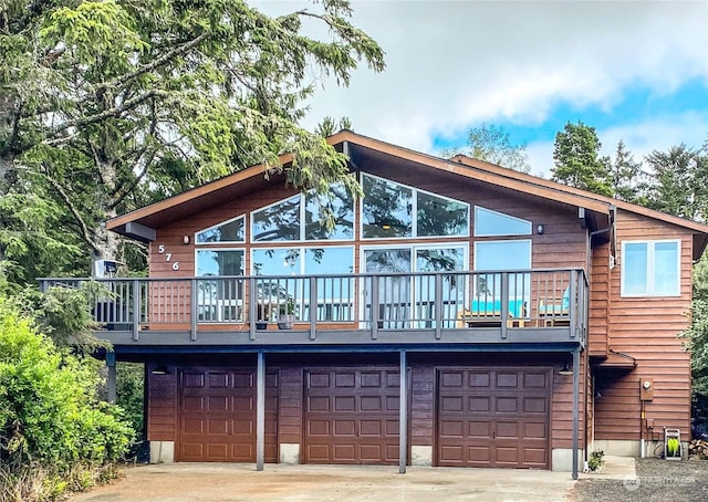 back of house with a garage