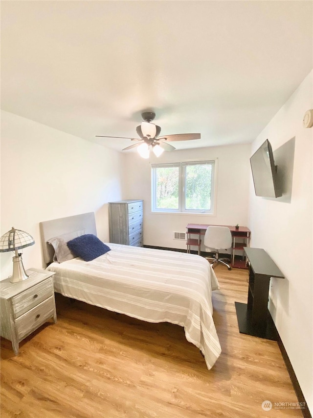 bedroom featuring ceiling fan and light wood-type flooring