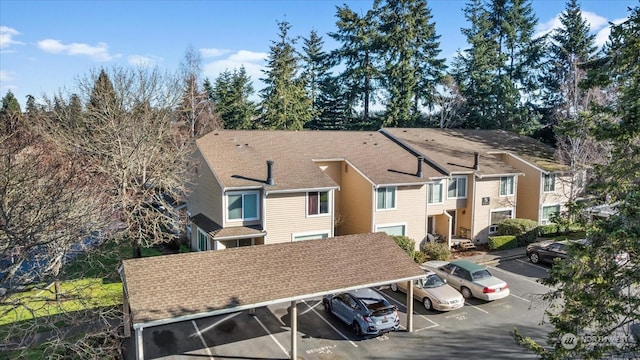 rear view of property featuring a carport